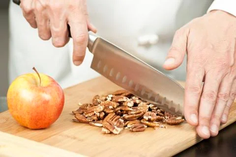 Chef chopping pecans Stock Photos