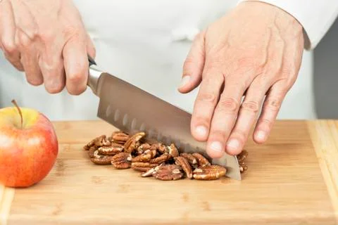 Chef chopping pecans Stock Photos