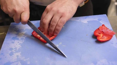 Chef chopping peppers Stock Footage 72976156