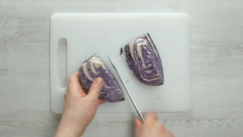 Chef chopping purple cabbage Stockbeeldmateriaal 105220757
