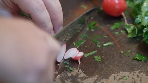 Chef chopping up a Raddish. Stock-Footage 107777704