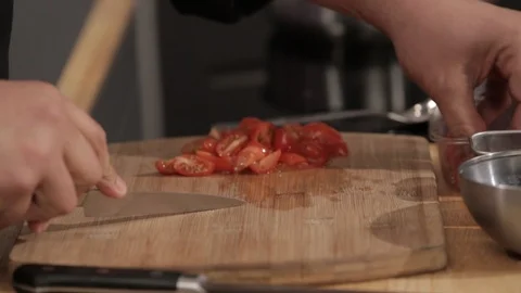 Chef chopping vegetables and putting it in a pan Stock Footage 85863622