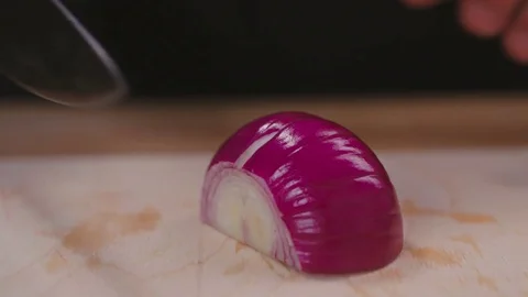 Chef chops and minces onion a before cooking Stock Footage 82488670