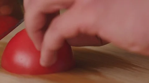 Chef chops and minces vegetables tomatoes a before cooking Stock Footage 82483849