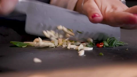 Chef chops mushrooms for dinner Stock Footage 205484565
