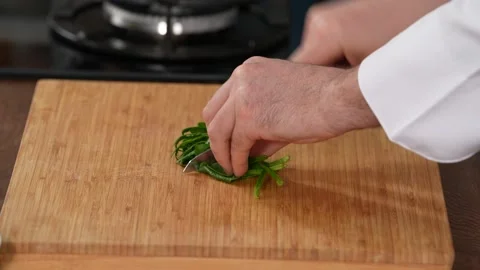 Chef chops spinach Stock Footage 183507464