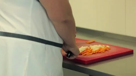 Chef chops vegetables Stock Footage 58520272