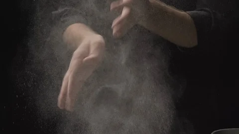 Chef clapping hands covered in flour. Baker working with dough and flour Stock Footage 129606625
