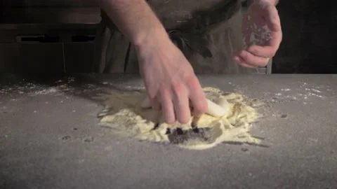 Chef clapping hands with flour and picking up a dough and throw it up in the air Stock Footage 153383441