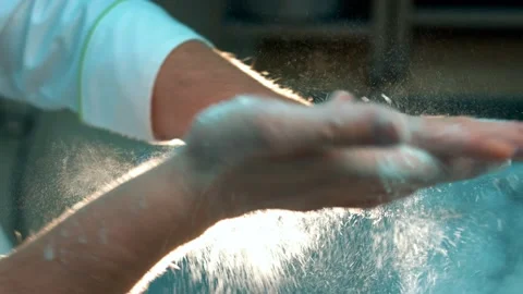 Chef clapping his hands filled with flour Stock Footage 134467809
