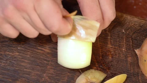 Chef clean the onion at cutting board. Stock Footage 255125188