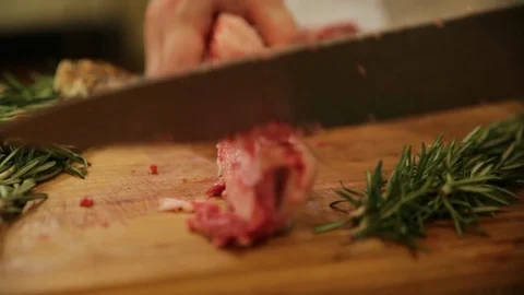 Chef cleaning bone raw steak Stock Footage 103675117