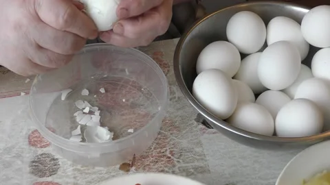 The chef is cleaning a chicken egg Stock Footage 164858051