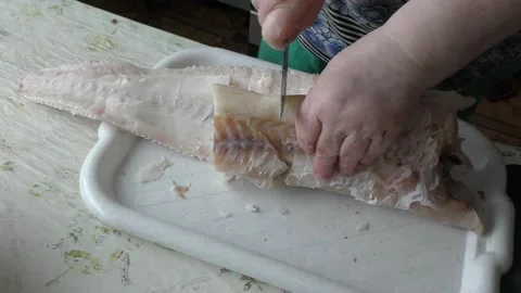 The chef is cleaning the cod fish.  healthy food concept Stock Footage 136638134