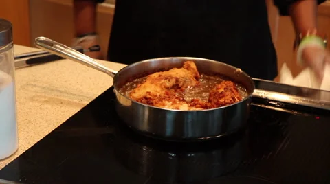 Chef Cleans Grease Around Fried Chicken Video stock 61407974
