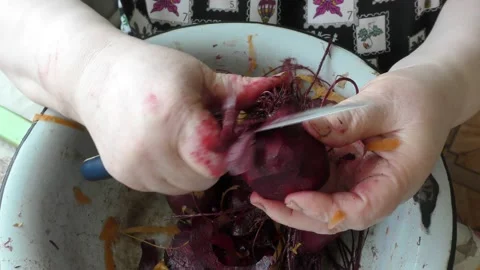 The chef cleans raw beets with a knife Stock Footage 170570556