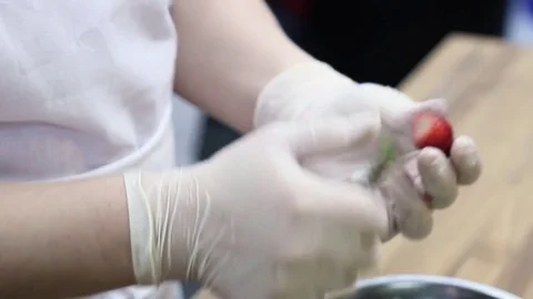 Chef cleans strawberries from tails Stock-Footage 70004401