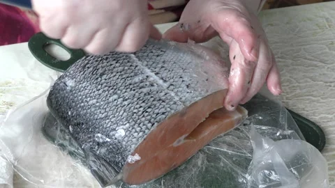 The chef cleans a trout fish with a knife.  healthy food concept 스톡 동영상 151910292