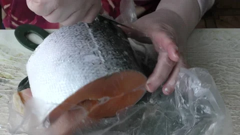The chef cleans a trout fish with a knife.  healthy food concept 스톡 동영상 151910834