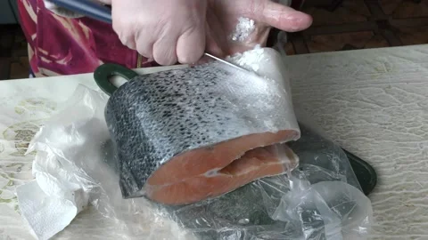 The chef cleans a trout fish with a knife.  healthy food concept Stock Footage 151910893