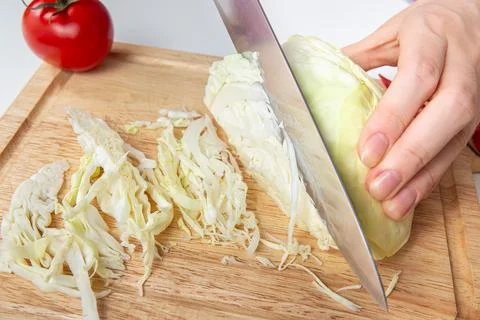 Chef Closeup Slicing White Cabbage On Wooden Cutting Board Stock Photos
