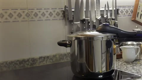 Chef closing pressure cooker lid in kitchen 스톡 동영상 300354732