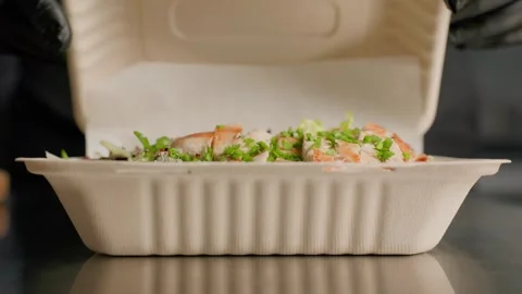 Chef Closing Takeaway Box with Grilled Chicken Salad Stock Footage 312814580