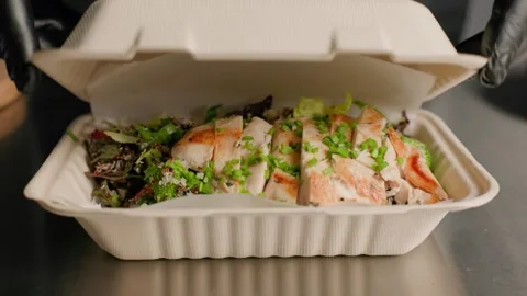 Chef Closing Takeaway Box with Grilled Chicken Salad Stock Footage 312814581
