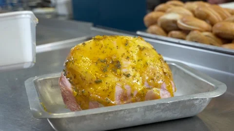 Chef Coating Ham with Marinade in Professional Kitchen Stock Footage 321366487
