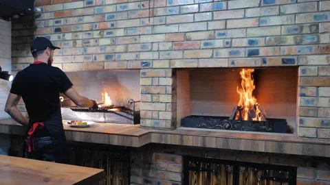The chef cocking a juicy grilled meat steak with an open flame. T-bon. Stock Footage 201964034