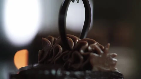 The chef completes the decoration and inserts a piece of dark chocolate Stock Footage 131230782