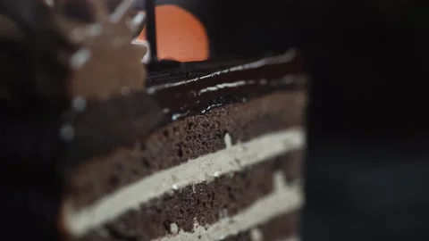 The chef completes the decoration of the dessert and pours the sliced cake slice Stock Footage 131230704