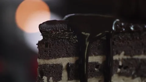 The chef completes the decoration of the dessert and pours the sliced cake Stock Footage 131230828