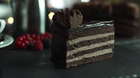 The chef completes the decoration of the dessert and pours the sliced cake slice Stock Footage 131230964