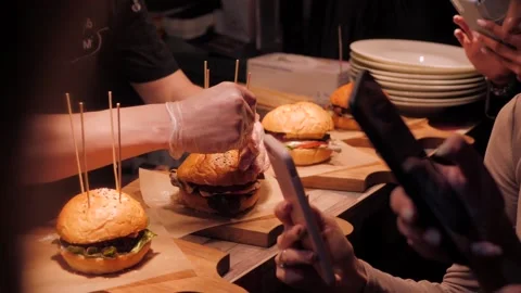 Chef conducts a master class and workshop on cooking burgers Stock Footage 143159494