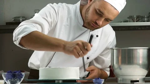Chef confectioner decorates cake. Modern Cake Stock Footage 83100315