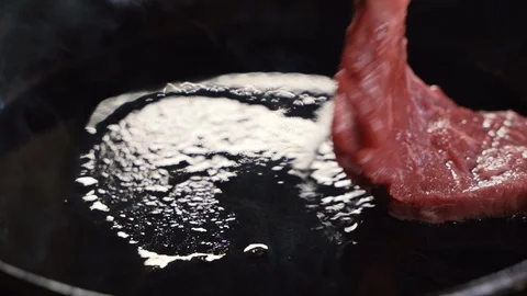 Chef cook a beef fillet in the pan. closeup. Slow motion Stock-Footage 108351816