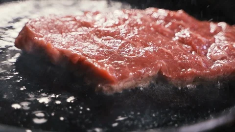 Chef cook a beef fillet in the pan. closeup. Slow motion Stockbeeldmateriaal 108352163