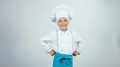 Chef cook child 7-8 years showing okey at camera standing isolated on white Video stock 67171055