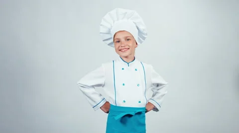 Chef cook child 7-8 years standing isolated on white background and smiling Stock Footage 67172316