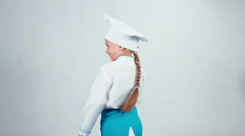 Chef cook child 7-8 years turned at camera and smiling standing isolated Vidéo 67172750