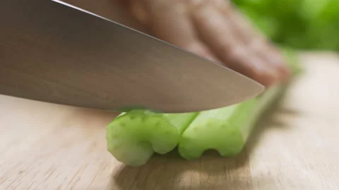 Chef cook cuts celery on cutting board. Stock Footage 101369924
