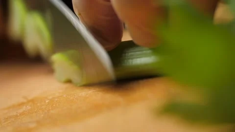 Chef cook cuts celery on cutting board. Stock Footage 136555435