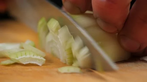 Chef cook cuts onion on cutting board. Stock Footage 236228699