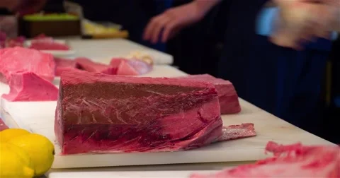 Chef cook cutting with knife raw tuna fish fillet 4k video. Japanese cuisine Stock Footage 67487755