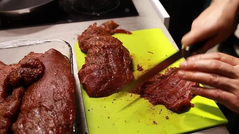 Chef cook cutting meat for steaks on board Stock Footage 113016698