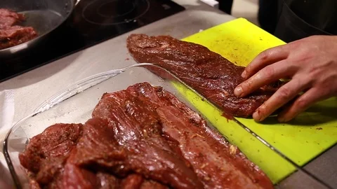 Chef cook cutting meat for steaks on board Stock Footage 113016704