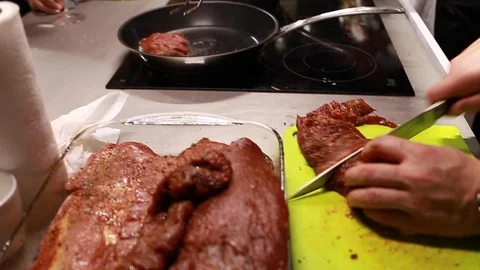 Chef cook cutting meat for steaks on board Stock Footage 115286686