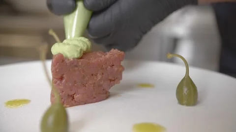 Chef cook decoring beef tatar in restaurant 4k Stock Footage 253413933