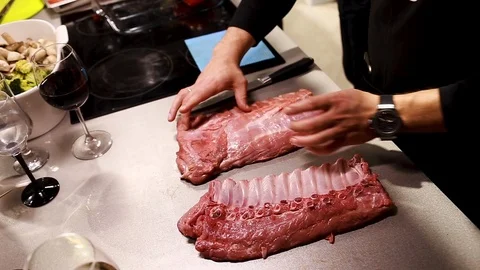 Chef cook explains how to cut meat rib eye for steaks Stock Footage 113016486